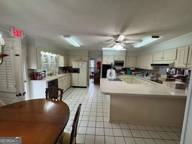 a view of walk in closet with clothes