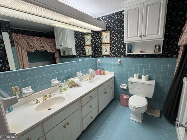 an aerial view of a house with a yard lake view and mountain view