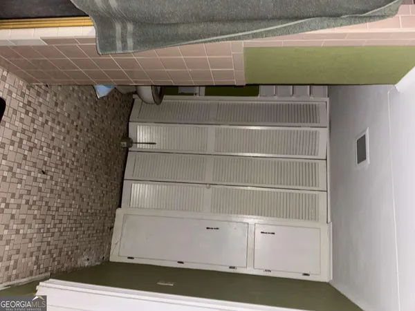 an aerial view of residential building with outdoor space and ocean