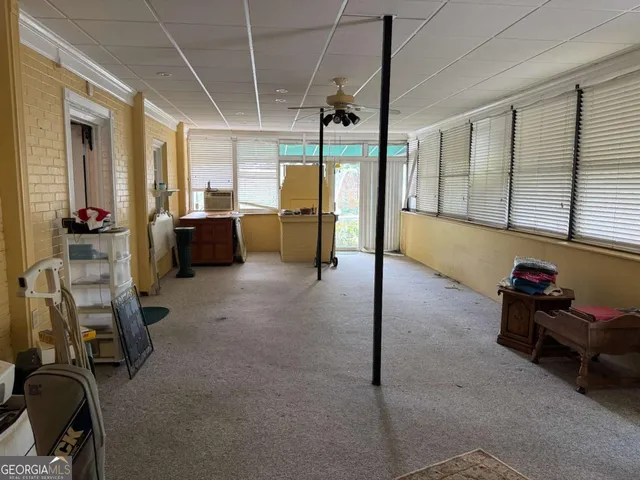 an aerial view of a residential houses with outdoor space