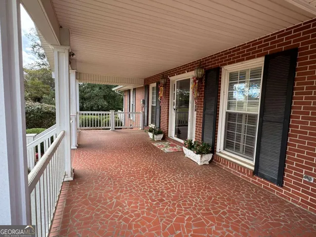 a view of a porch with furniture