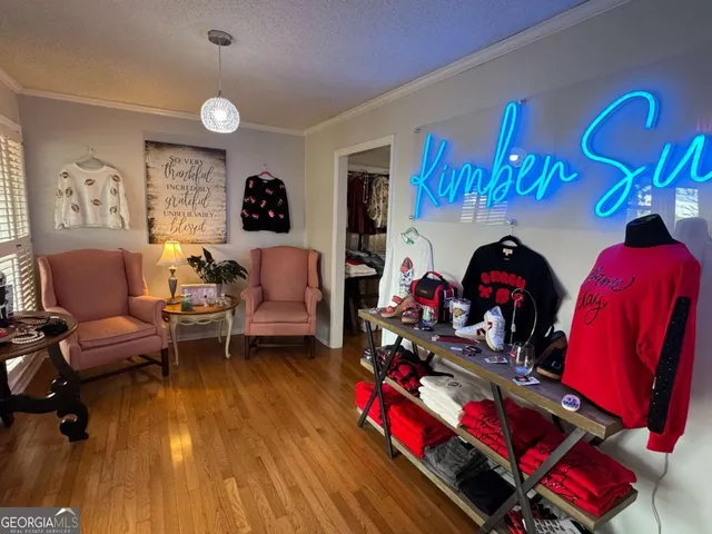 a living room with furniture a rug and a chandelier