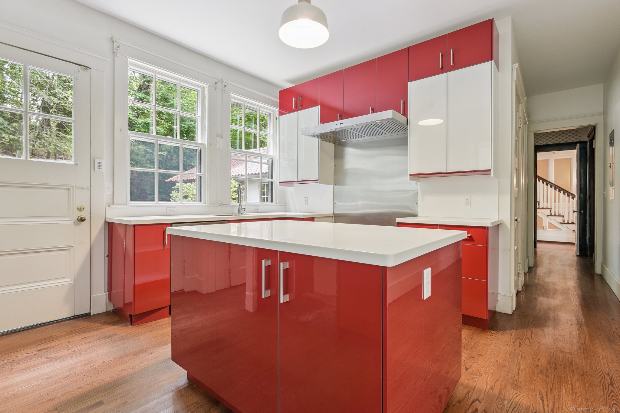 1056 Whitney Avenue Hamden, CT 06517 - Photo 15 of 40 a kitchen with a stove a sink and a refrigerator