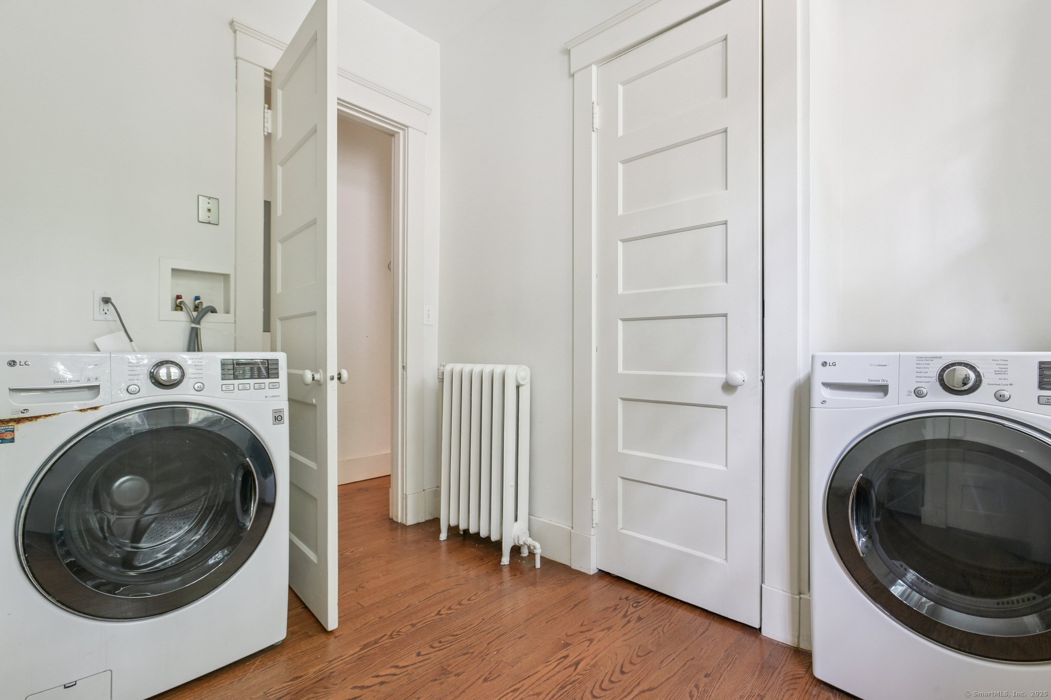 1056 Whitney Avenue Hamden, CT 06517 - Photo 18 of 40 a view of a hallway with washer and dryer