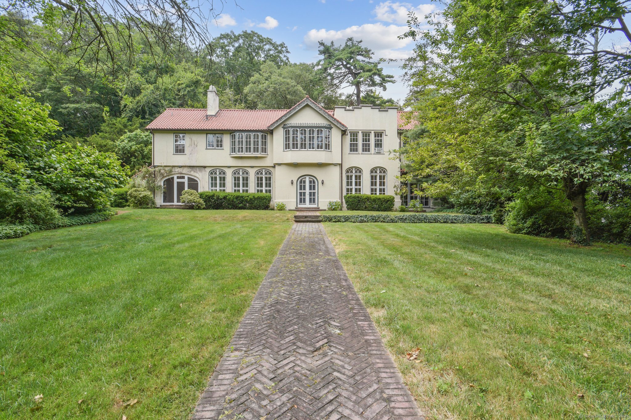 1056 Whitney Avenue Hamden, CT 06517 - Photo 2 of 40 a front view of a house with a yard
