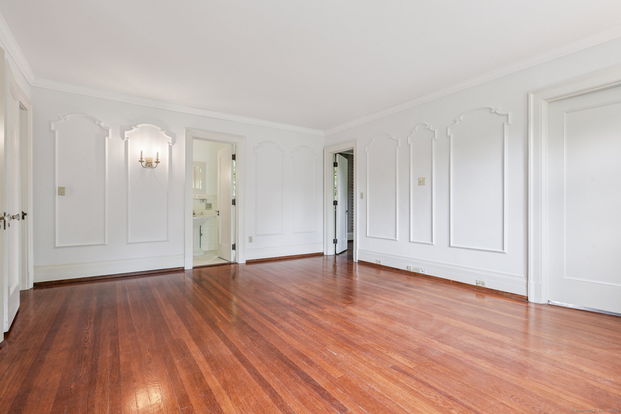 1056 Whitney Avenue Hamden, CT 06517 - Photo 22 of 40 a view of an empty room and wooden floor
