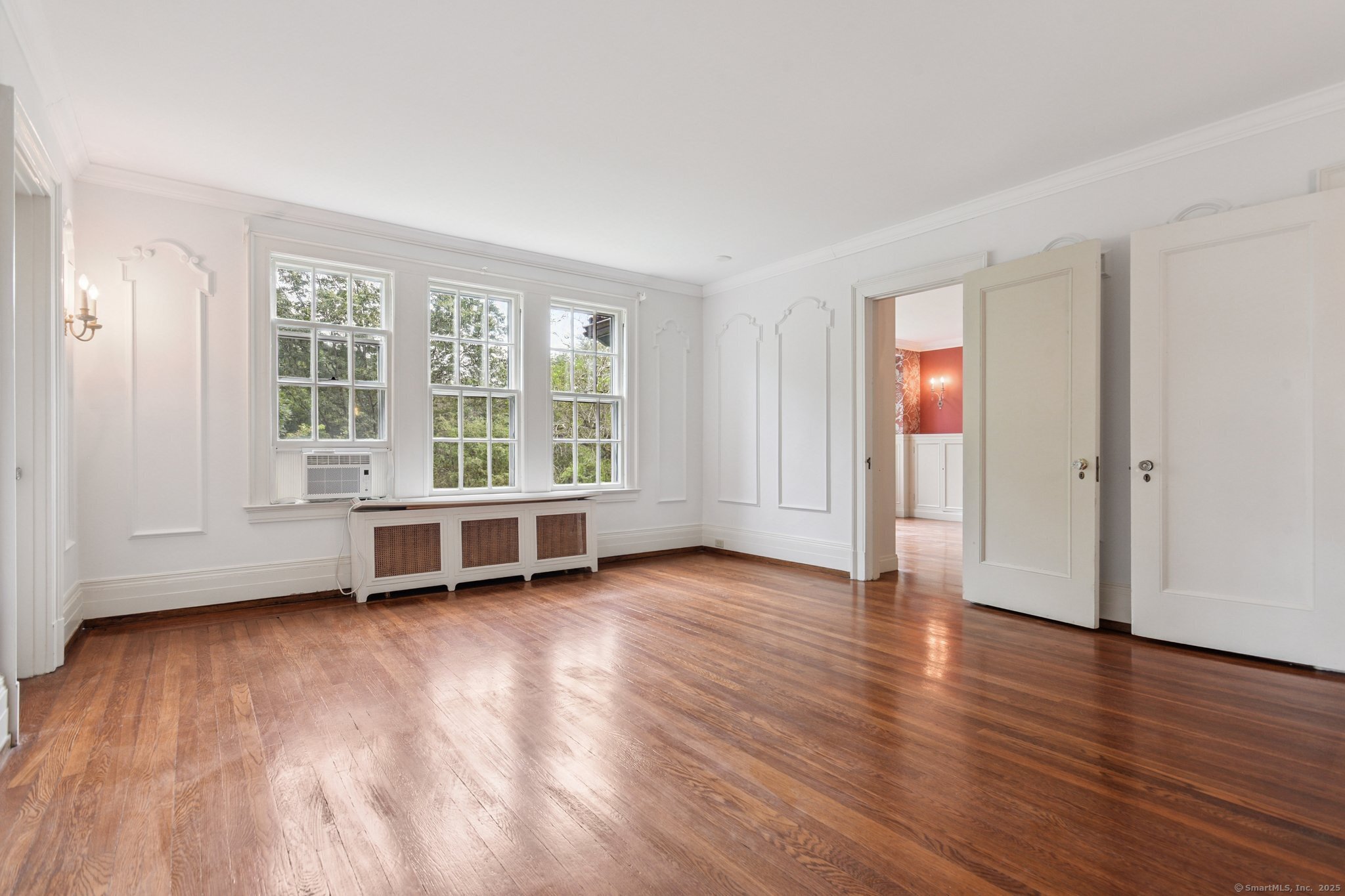 1056 Whitney Avenue Hamden, CT 06517 - Photo 23 of 40 an empty room with wooden floor and windows