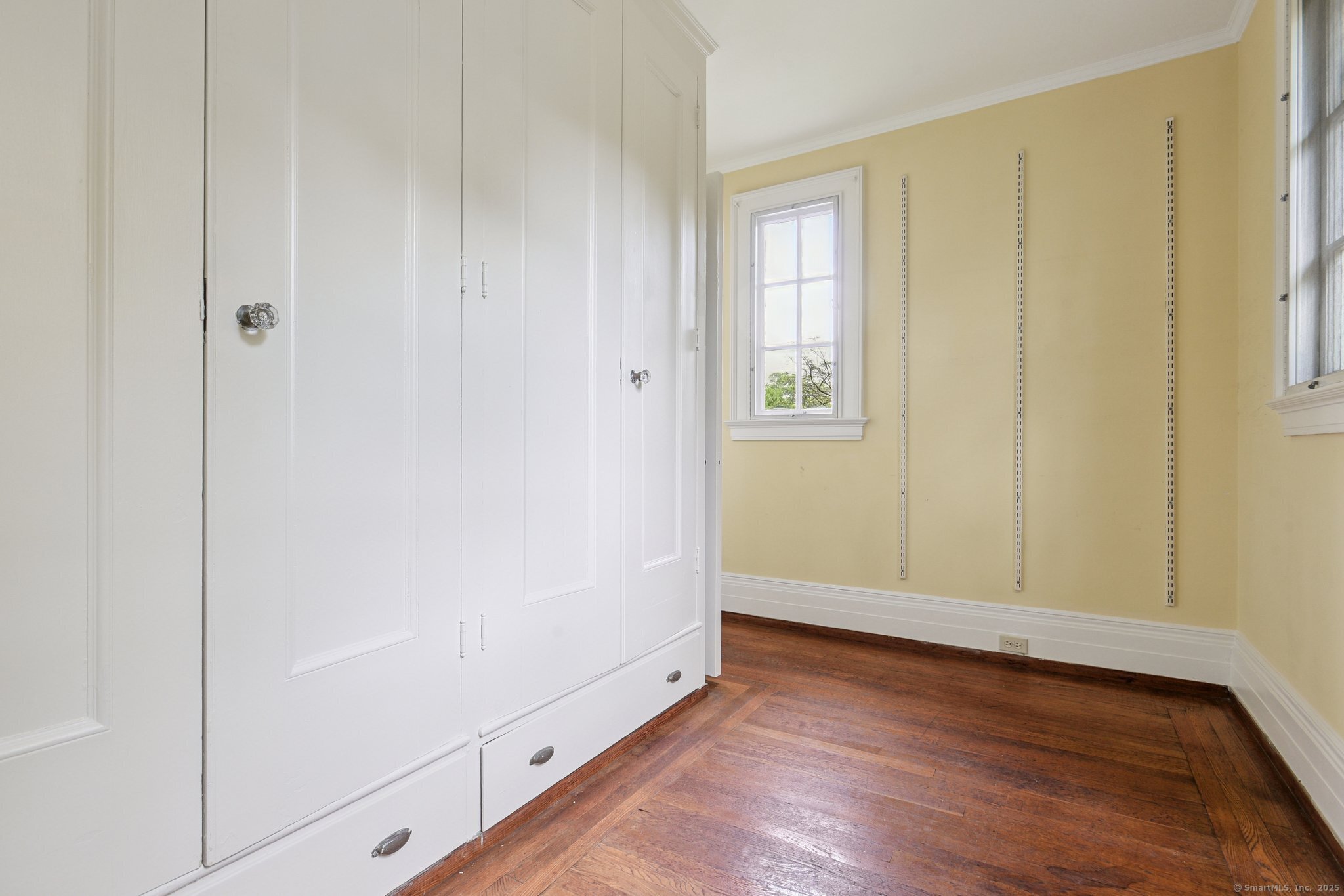 1056 Whitney Avenue Hamden, CT 06517 - Photo 25 of 40 a view of an empty room with wooden floor