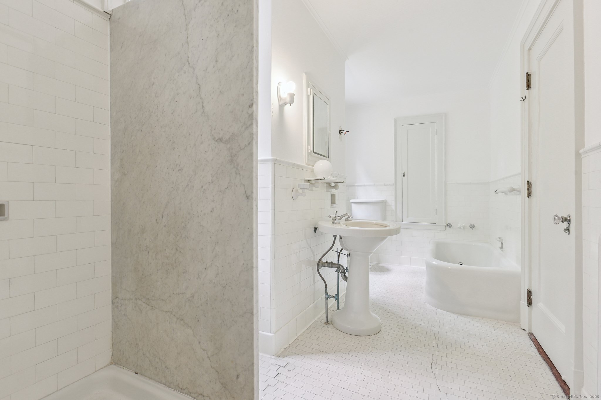 1056 Whitney Avenue Hamden, CT 06517 - Photo 26 of 40 a bathroom with a bathtub and a shower