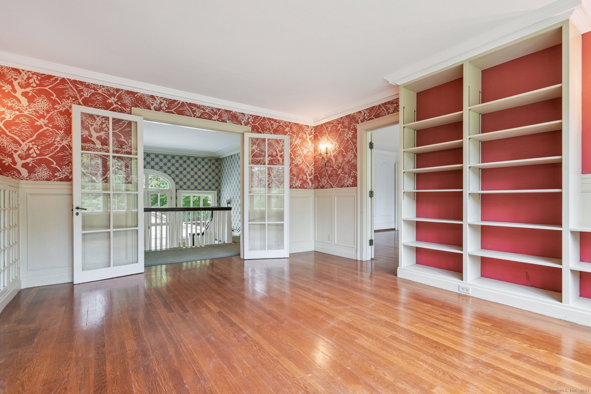 1056 Whitney Avenue Hamden, CT 06517 - Photo 29 of 40 a view of an empty room with wooden floor and a window