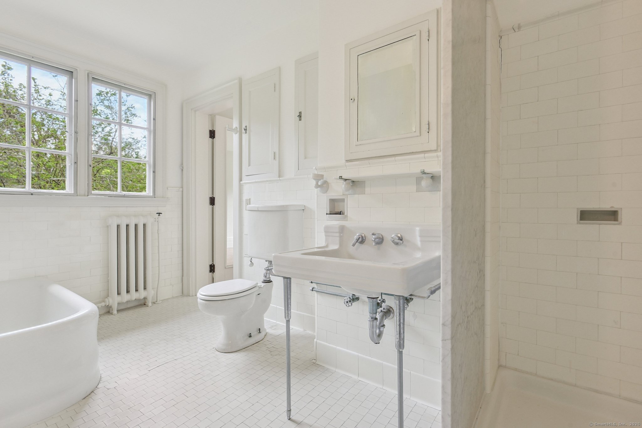 1056 Whitney Avenue Hamden, CT 06517 - Photo 31 of 40 a bathroom with a sink toilet and shower