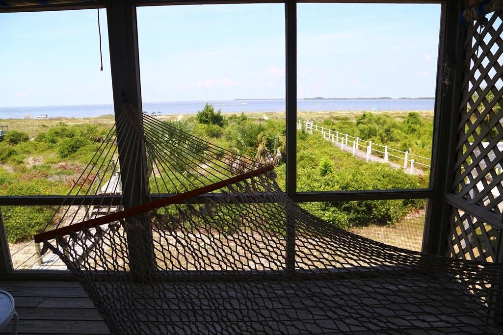 3530 Yacht Club Road Edisto Beach, SC 29438 - Photo 11 of 22 Screen porch w/hammock