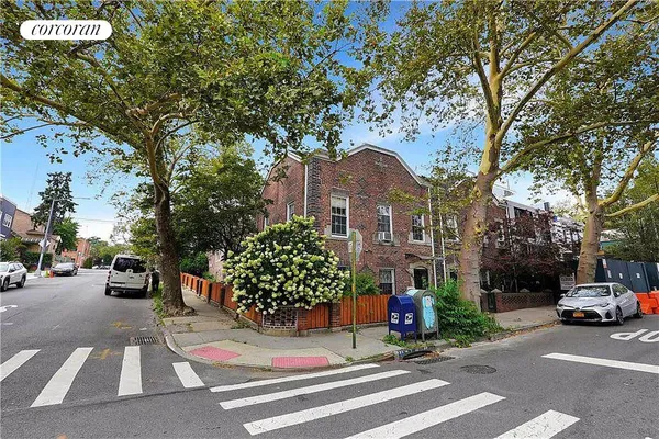 a view of street with parked cars