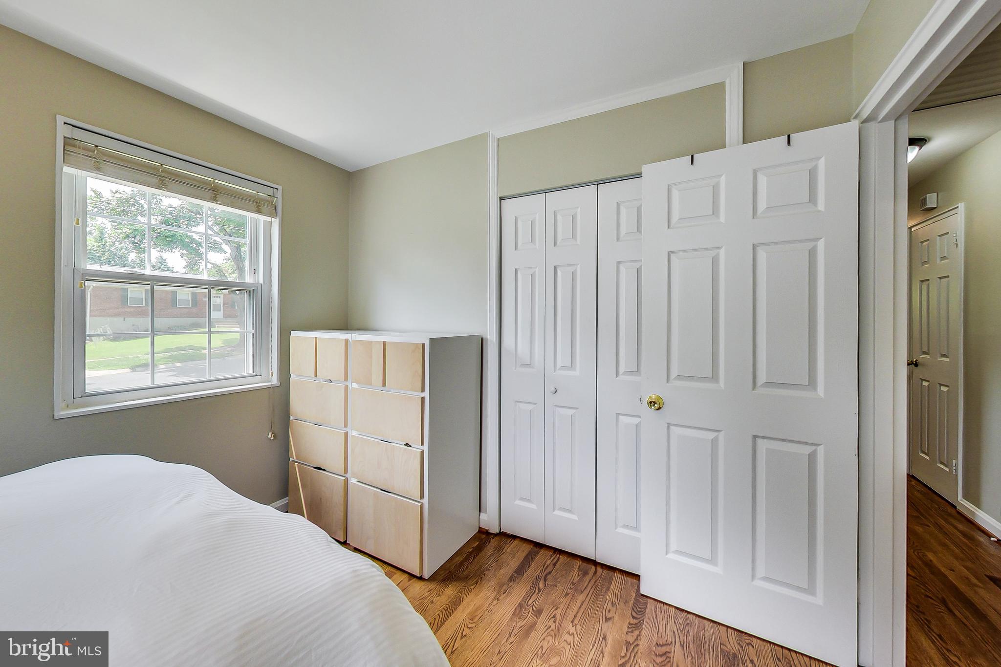 4715 Oxbow Road Rockville, MD 20852 - Photo 14 of 35 a view of an empty room with wooden floor and a window