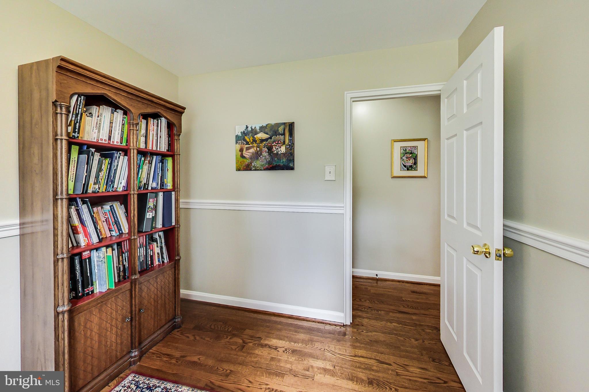 4715 Oxbow Road Rockville, MD 20852 - Photo 16 of 35 a view of a livingroom with lots of books