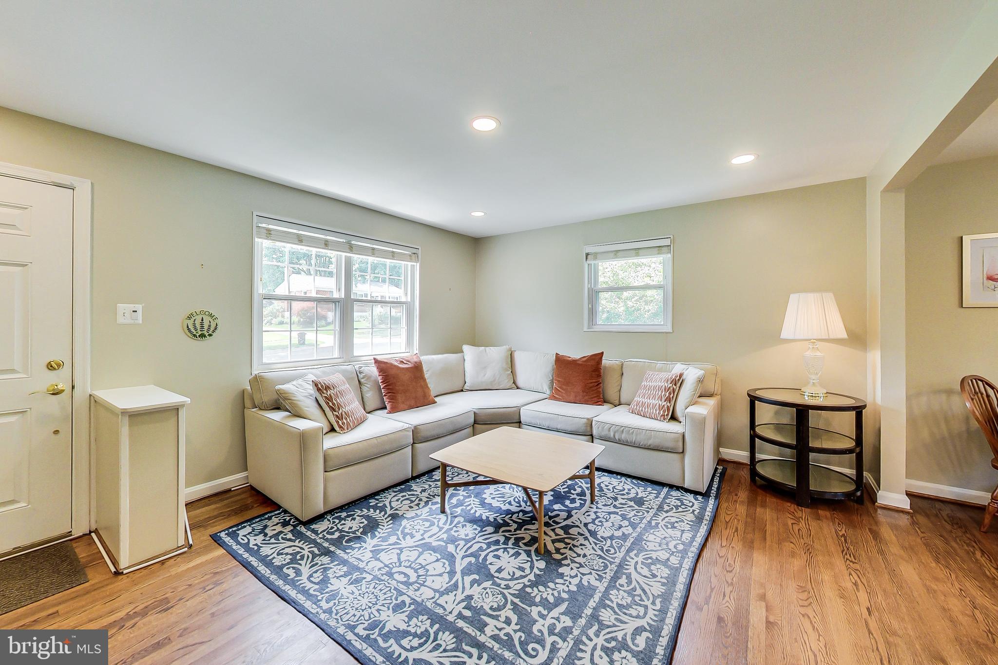 4715 Oxbow Road Rockville, MD 20852 - Photo 2 of 35 a living room with furniture and a rug