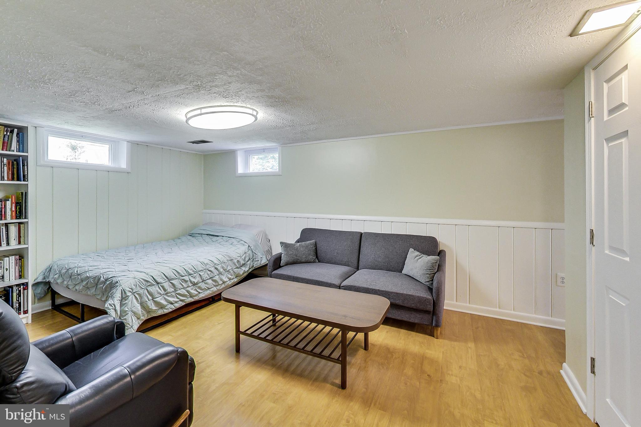 4715 Oxbow Road Rockville, MD 20852 - Photo 22 of 35 a living room with furniture and a couch