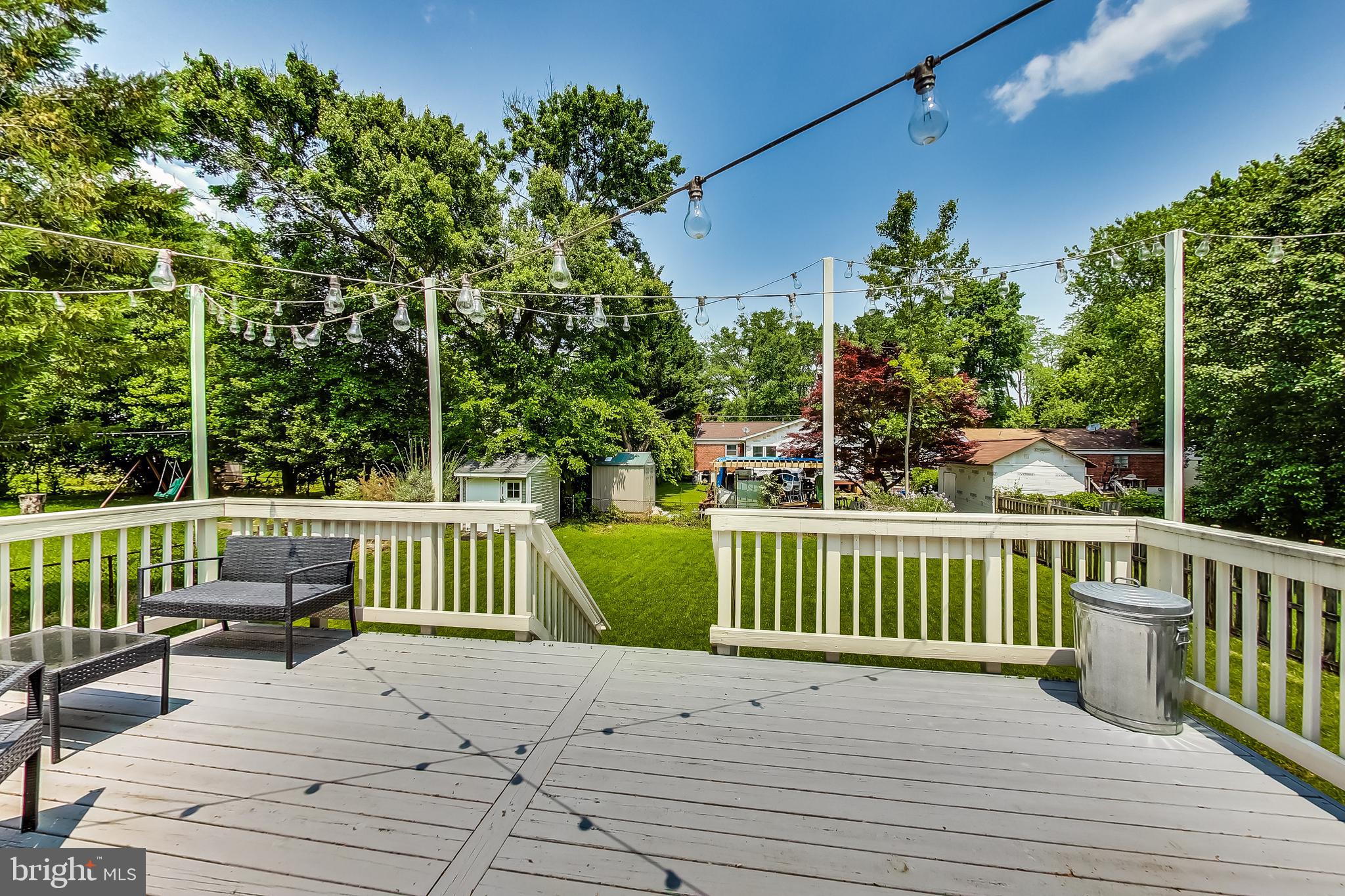 4715 Oxbow Road Rockville, MD 20852 - Photo 26 of 35 a view of a deck with two chairs and wooden fence