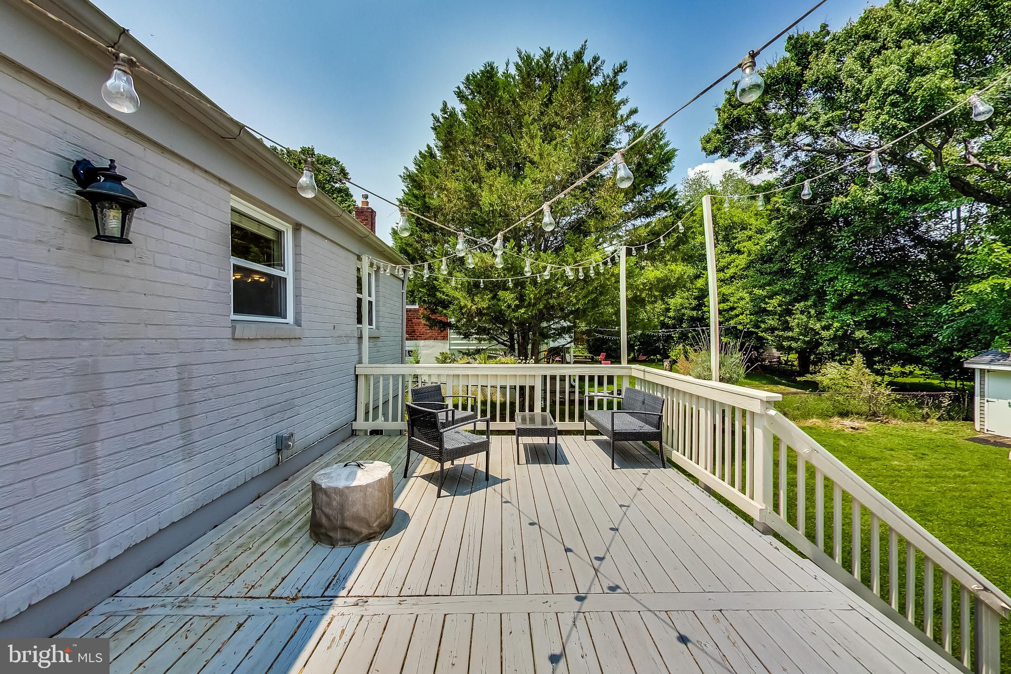 4715 Oxbow Road Rockville, MD 20852 - Photo 27 of 35 a view of balcony with wooden floor and outdoor seating