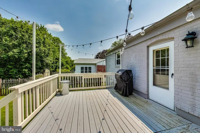 a view of a house with wooden deck