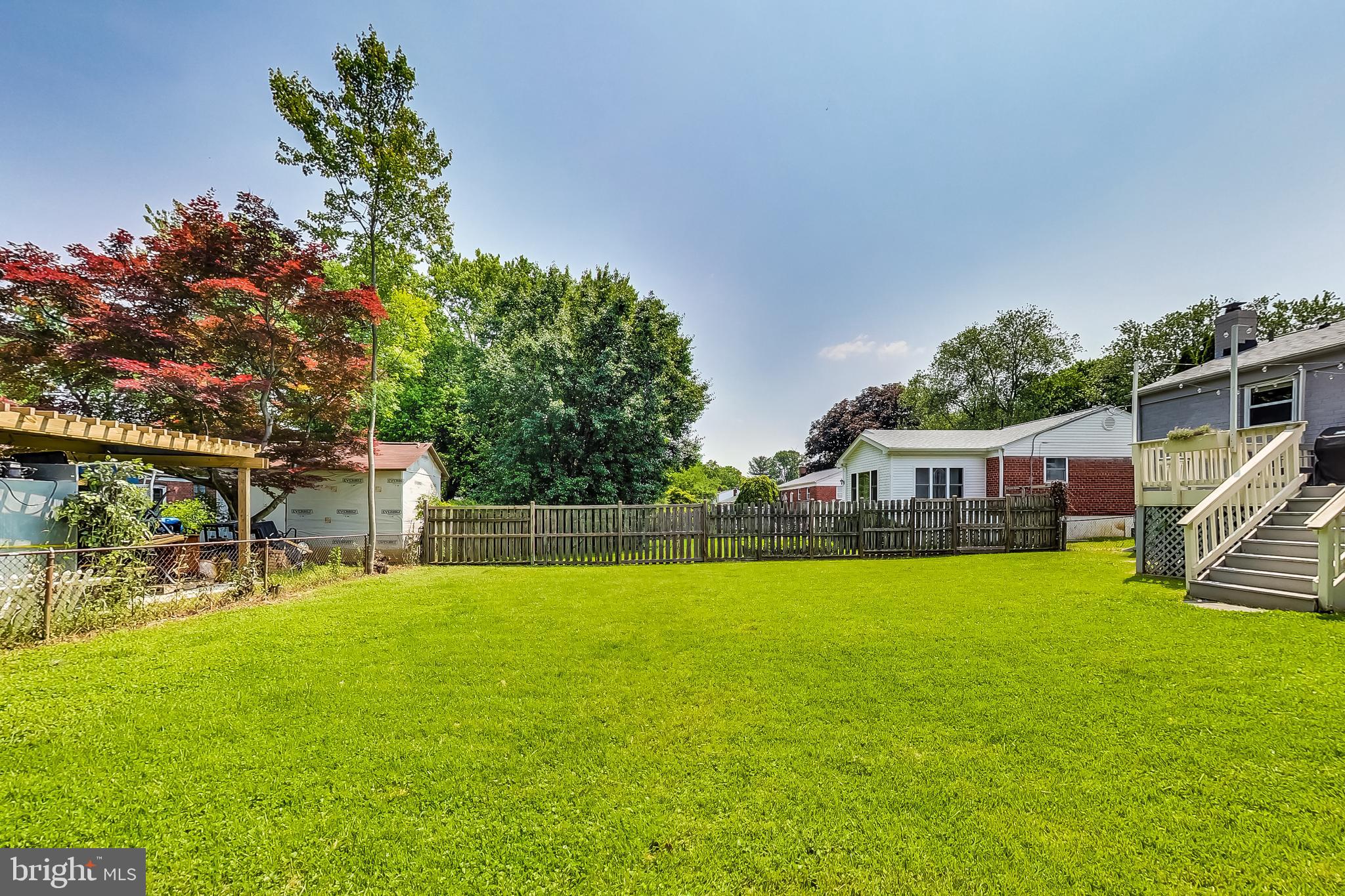 4715 Oxbow Road Rockville, MD 20852 - Photo 33 of 35 a view of a house with a yard and sitting area