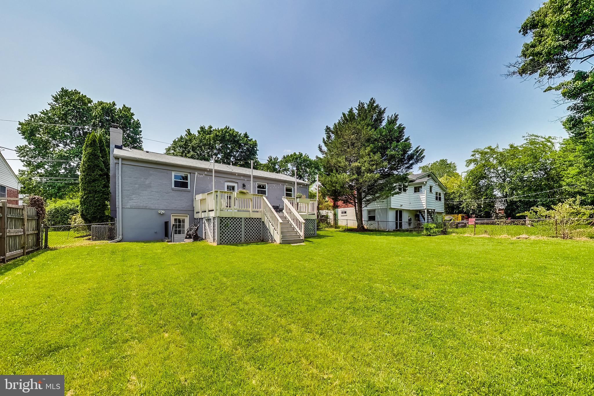 4715 Oxbow Road Rockville, MD 20852 - Photo 34 of 35 a house with a yard in front of it
