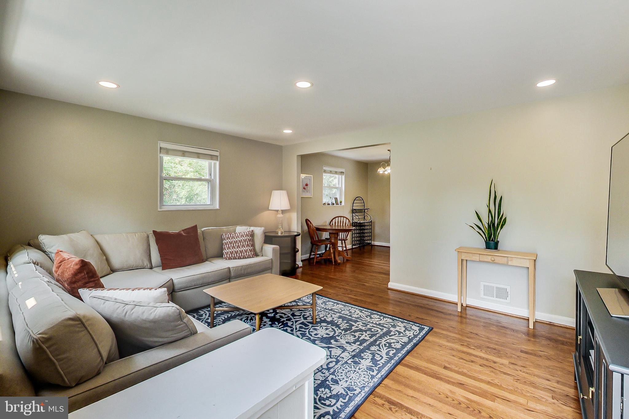 4715 Oxbow Road Rockville, MD 20852 - Photo 4 of 35 a living room with furniture and a wooden floor