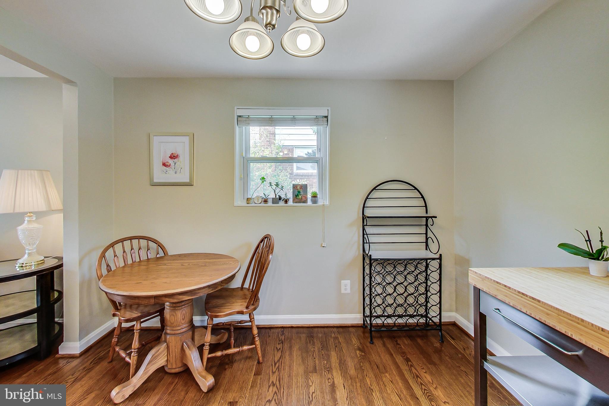 4715 Oxbow Road Rockville, MD 20852 - Photo 8 of 35 a view of a dining room with furniture window and wooden floor