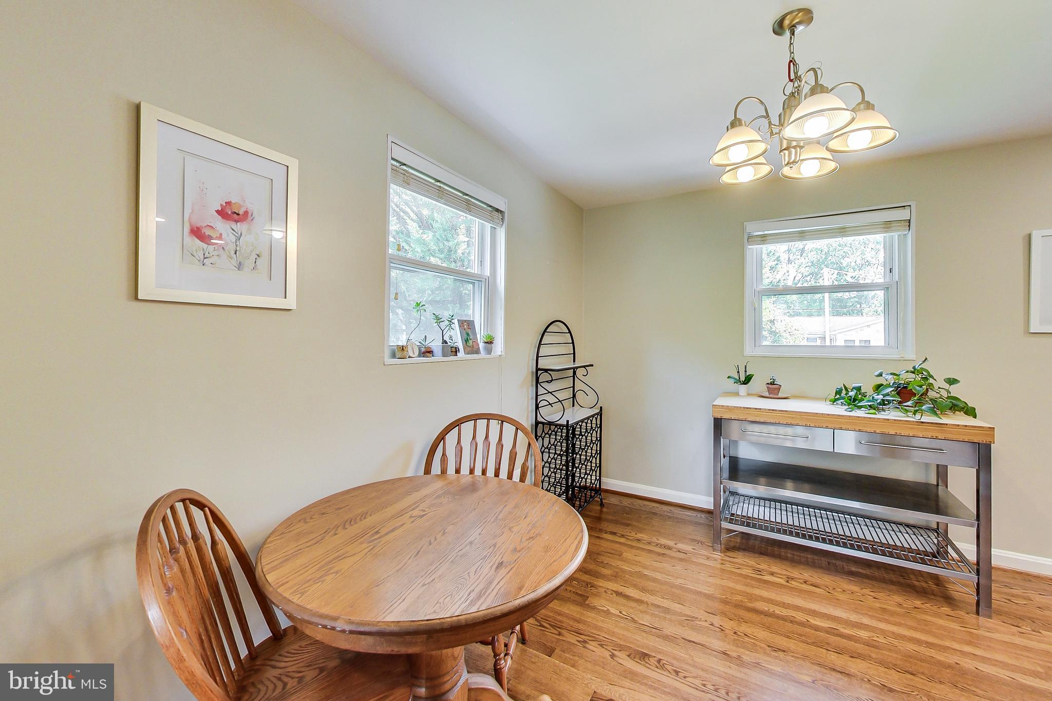 4715 Oxbow Road Rockville, MD 20852 - Photo 9 of 35 a view of a dining room with furniture window and wooden floor