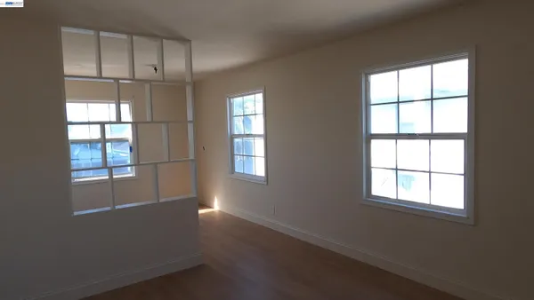 a view of an empty room with a window