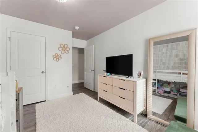 a bedroom with furniture and a dresser