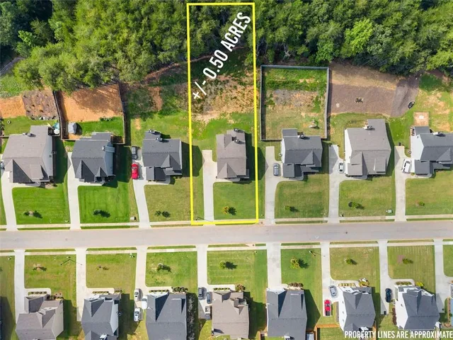an aerial view of a house with a swimming pool