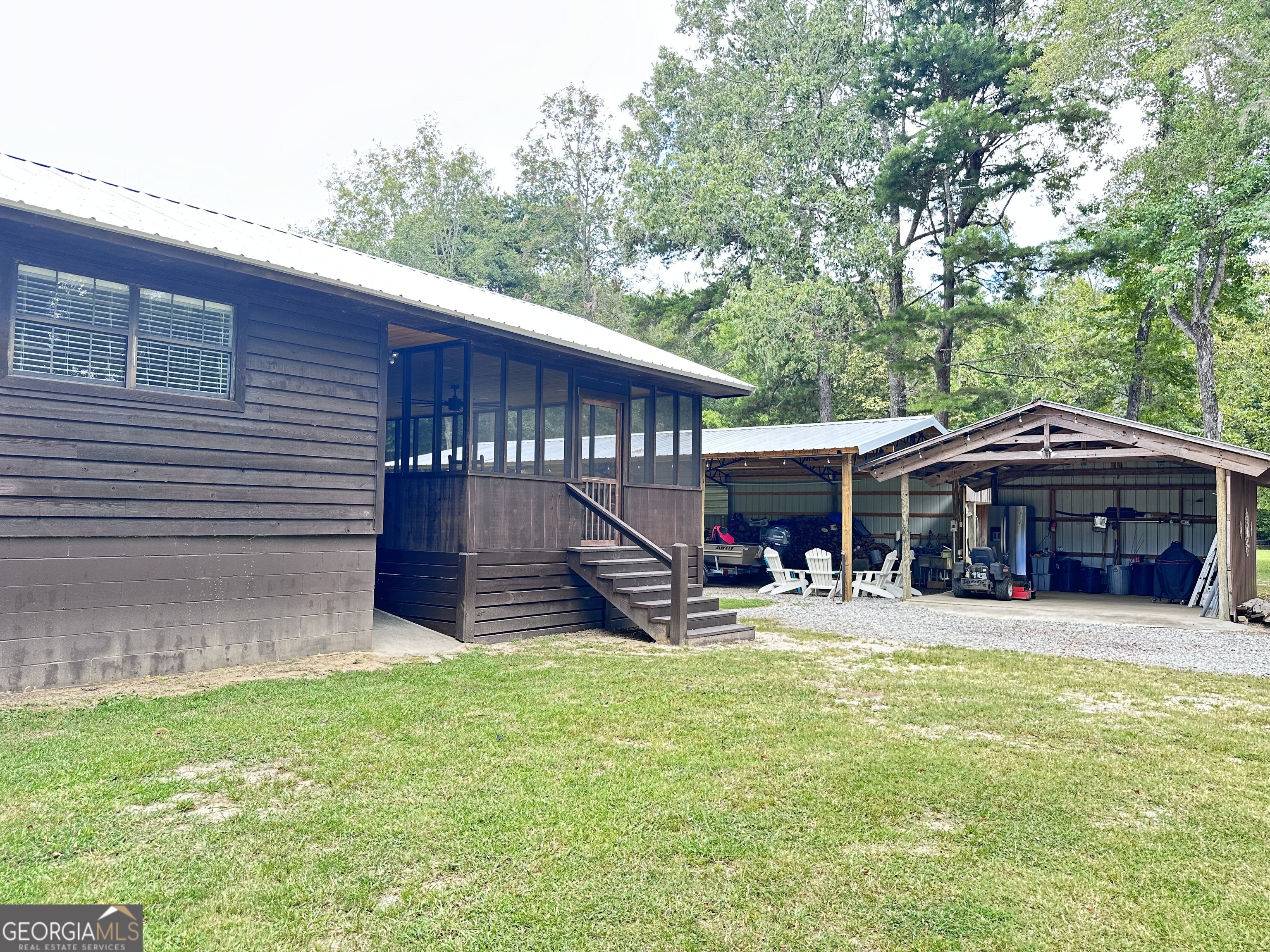 226 Cherokee Road Glenwood, GA 30428 - Photo 29 of 117 a view of a house with a yard patio and wooden fence