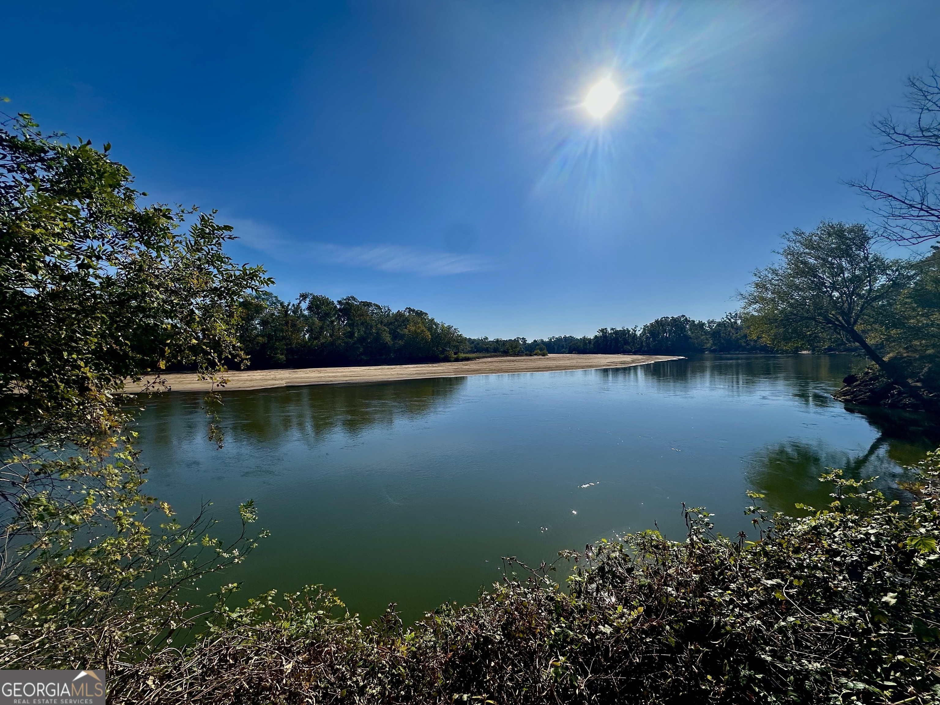 226 Cherokee Road Glenwood, GA 30428 - Photo 3 of 117 a view of a lake with a house in the background