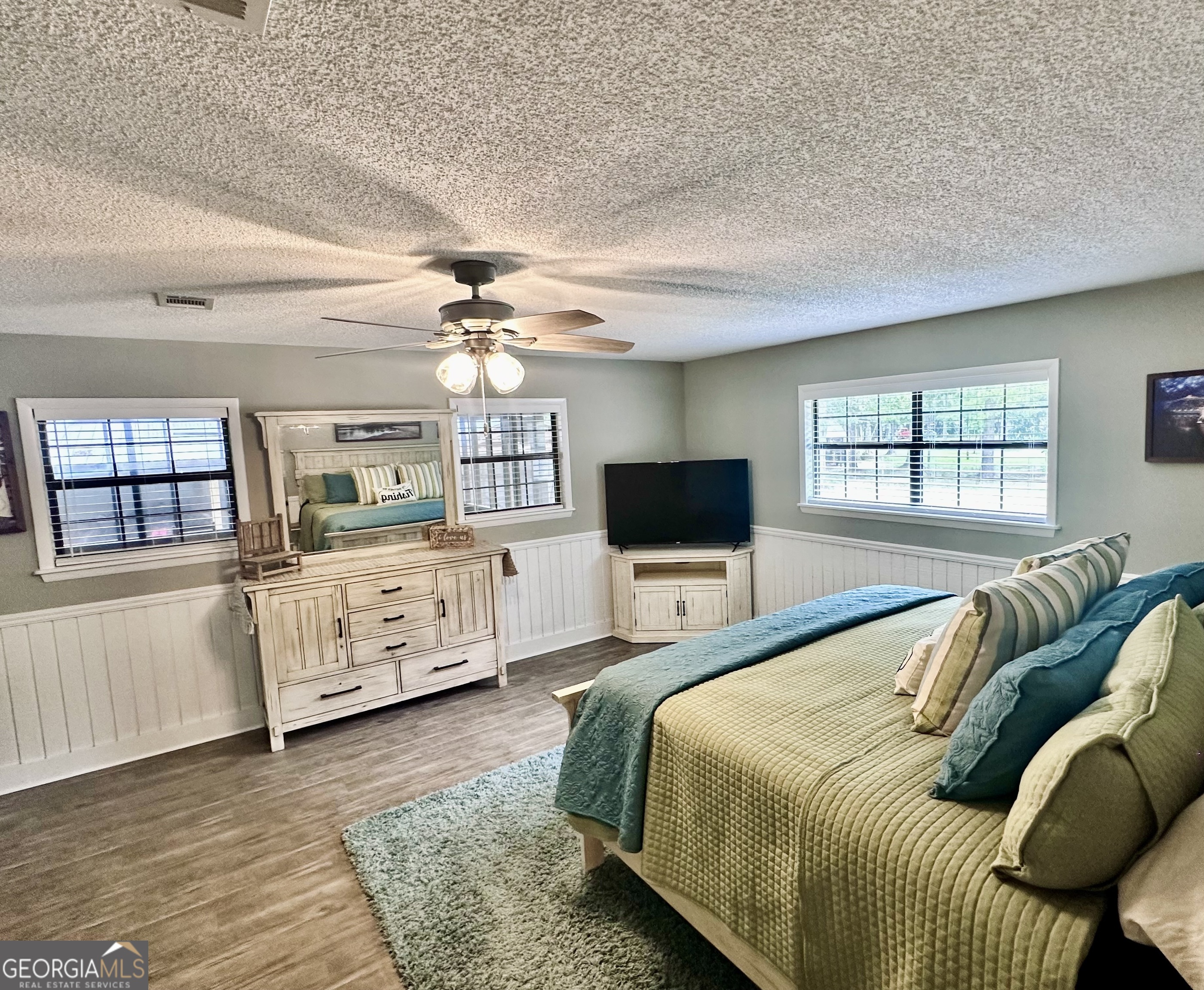 226 Cherokee Road Glenwood, GA 30428 - Photo 41 of 117 a bedroom with a bed a couch and dresser