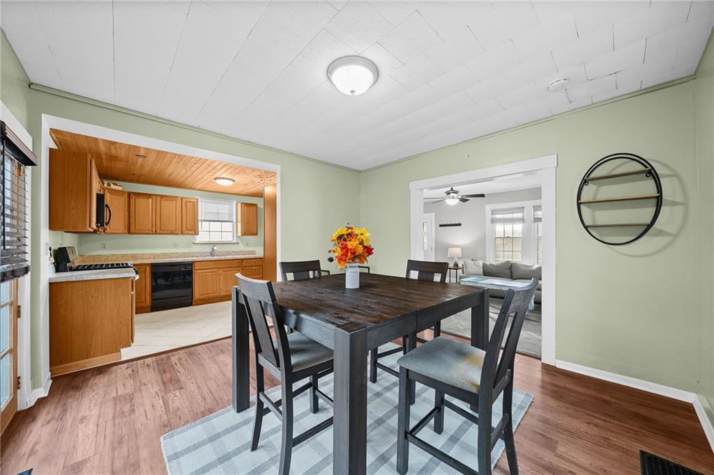180 Hinkel Road Pittsburgh, PA 15229 - Photo 14 of 45 a view of a dining room with furniture and wooden floor