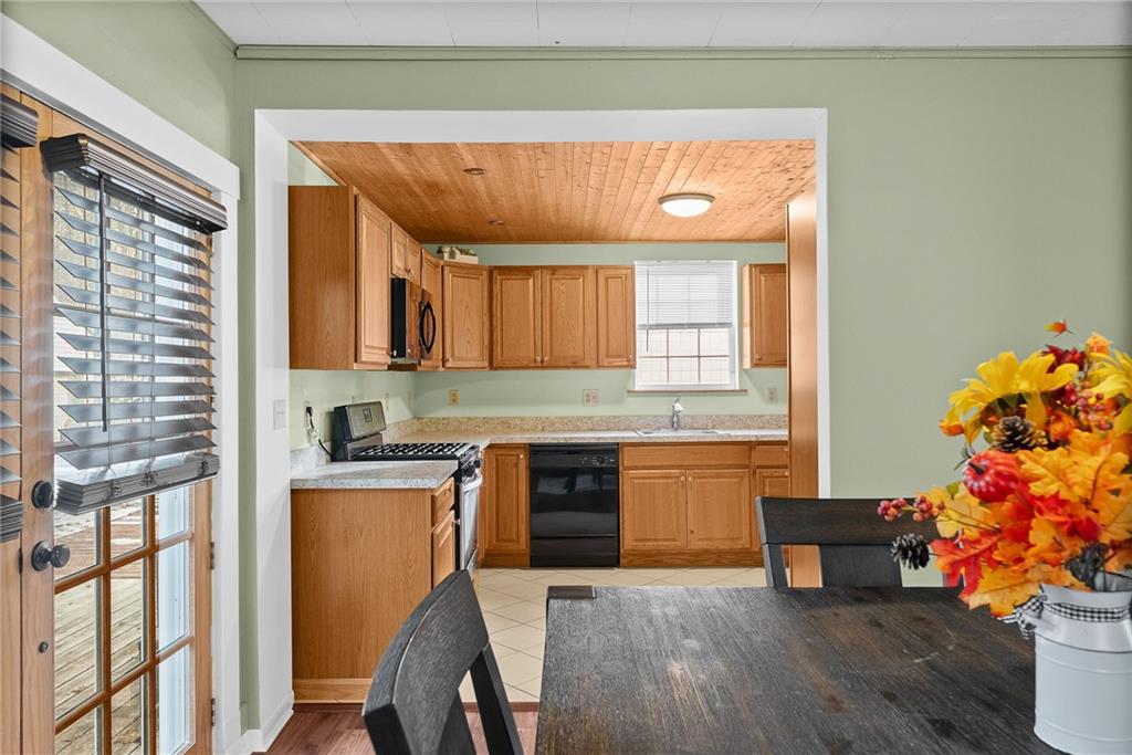 180 Hinkel Road Pittsburgh, PA 15229 - Photo 15 of 45 a kitchen with granite countertop white cabinets and wooden floor