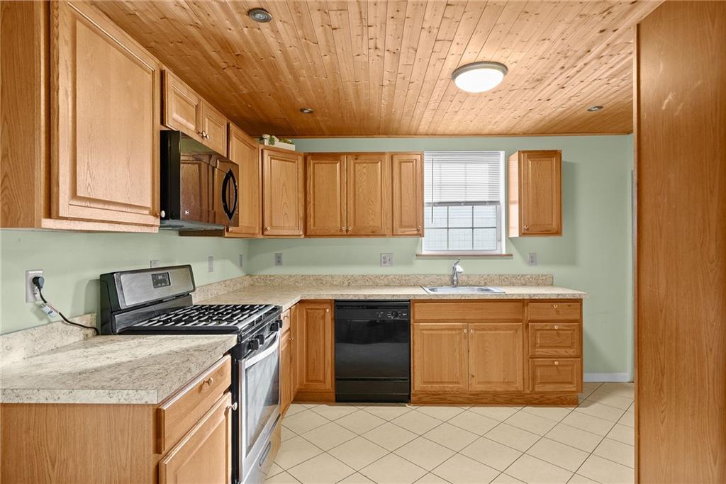 180 Hinkel Road Pittsburgh, PA 15229 - Photo 16 of 45 a kitchen that has a sink and a stove in it