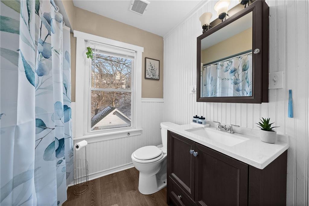 180 Hinkel Road Pittsburgh, PA 15229 - Photo 27 of 45 a bathroom with a double vanity sink toilet and a tub