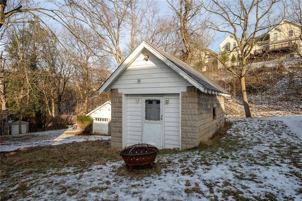 180 Hinkel Road Pittsburgh, PA 15229 - Photo 37 of 45 a view of a small house with a small yard and large tree