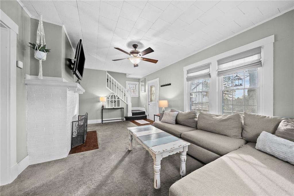 180 Hinkel Road Pittsburgh, PA 15229 - Photo 7 of 45 a living room with furniture and a large window