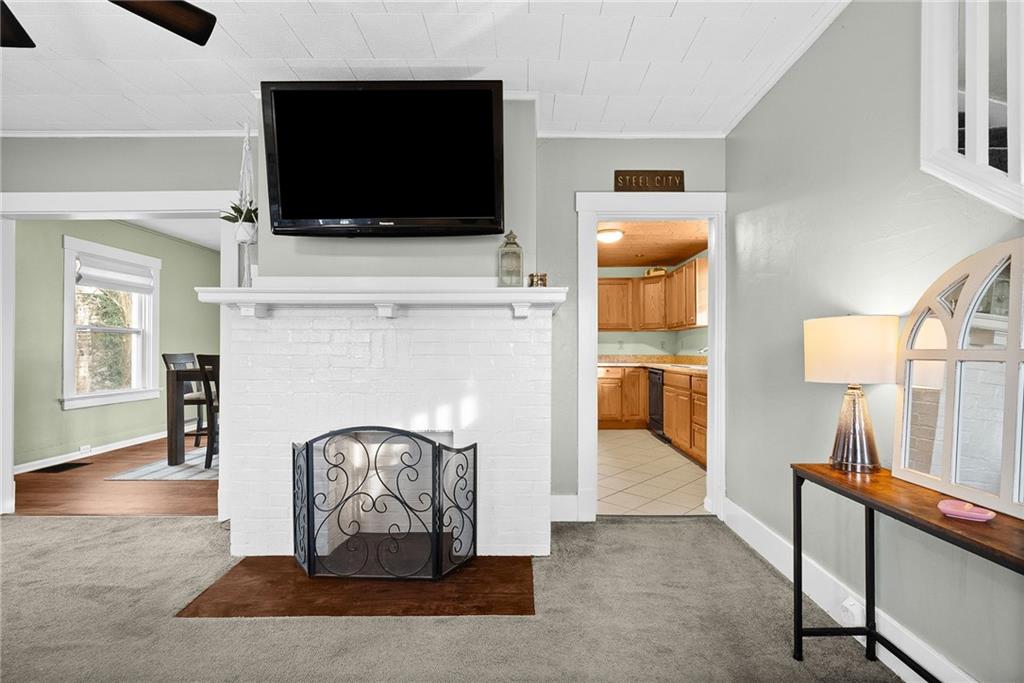 180 Hinkel Road Pittsburgh, PA 15229 - Photo 10 of 45 a living room with furniture and a flat screen tv