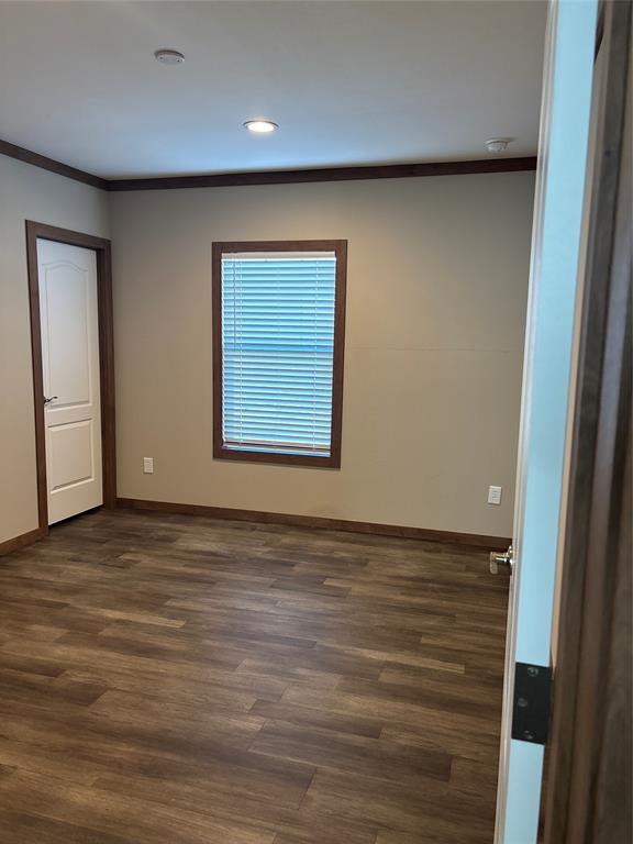 480 Cordell Road Sadler, TX 76264 - Photo 14 of 25 an empty room with wooden floor and windows