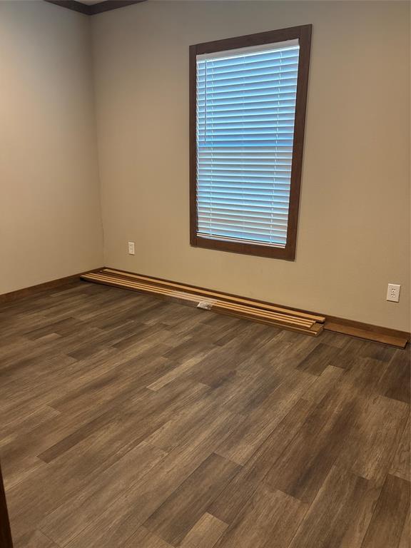 480 Cordell Road Sadler, TX 76264 - Photo 15 of 25 an empty room with wooden floor and windows