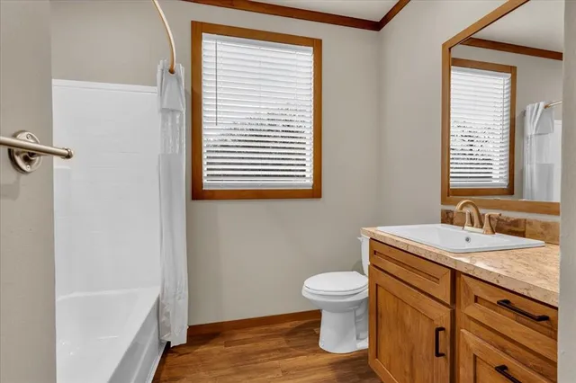 a bathroom with a sink toilet and tub