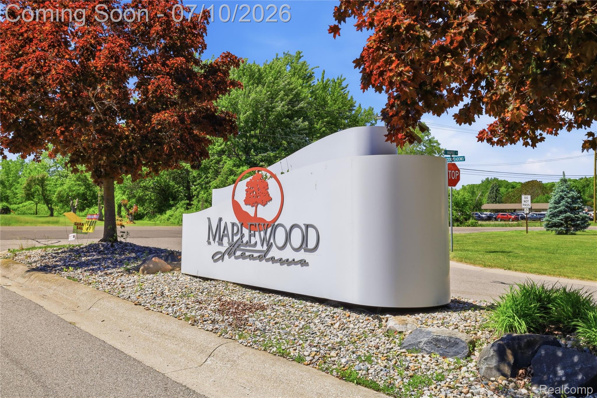 5275 East Maple Avenue Grand Blanc, MI 48439 - Photo 7 of 53 Maplewood Meadows community signage featuring a contemporary design with a prominent maple tree logo