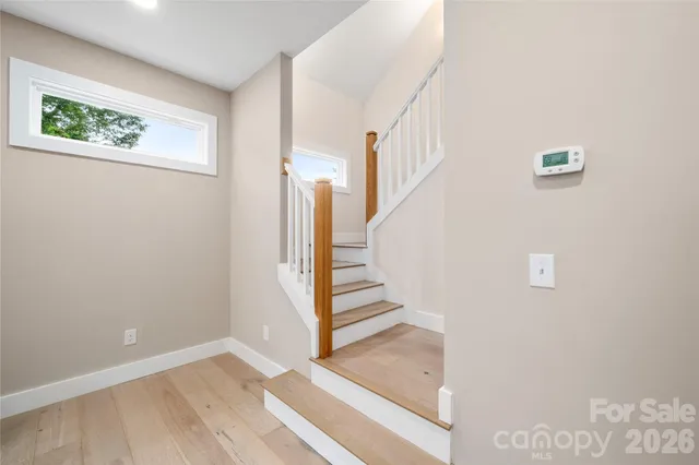 a view of a hallway with staircase