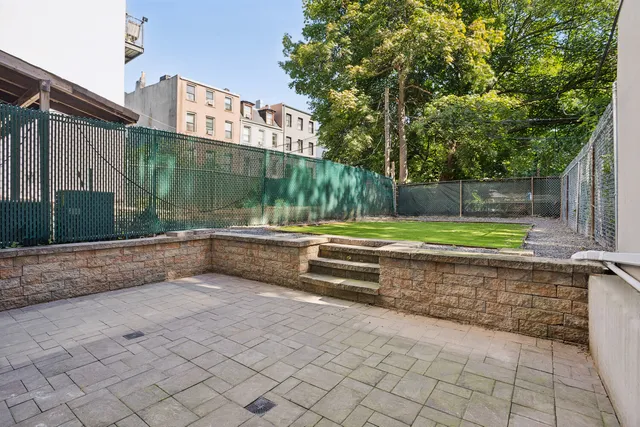a kitchen with stainless steel appliances granite countertop a stove and a refrigerator