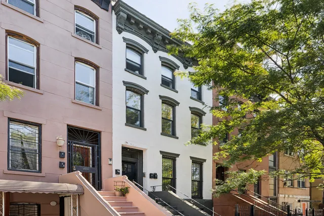a view of a building with a tree