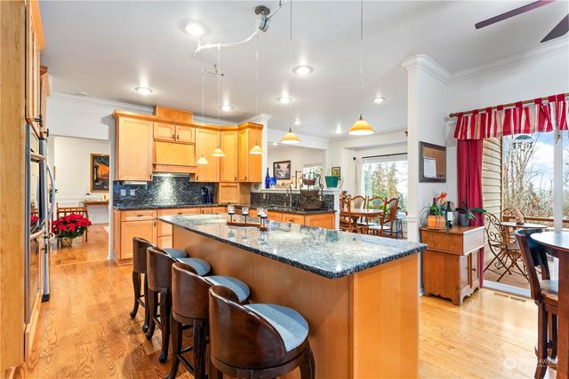 a kitchen with counter space appliances and a large window